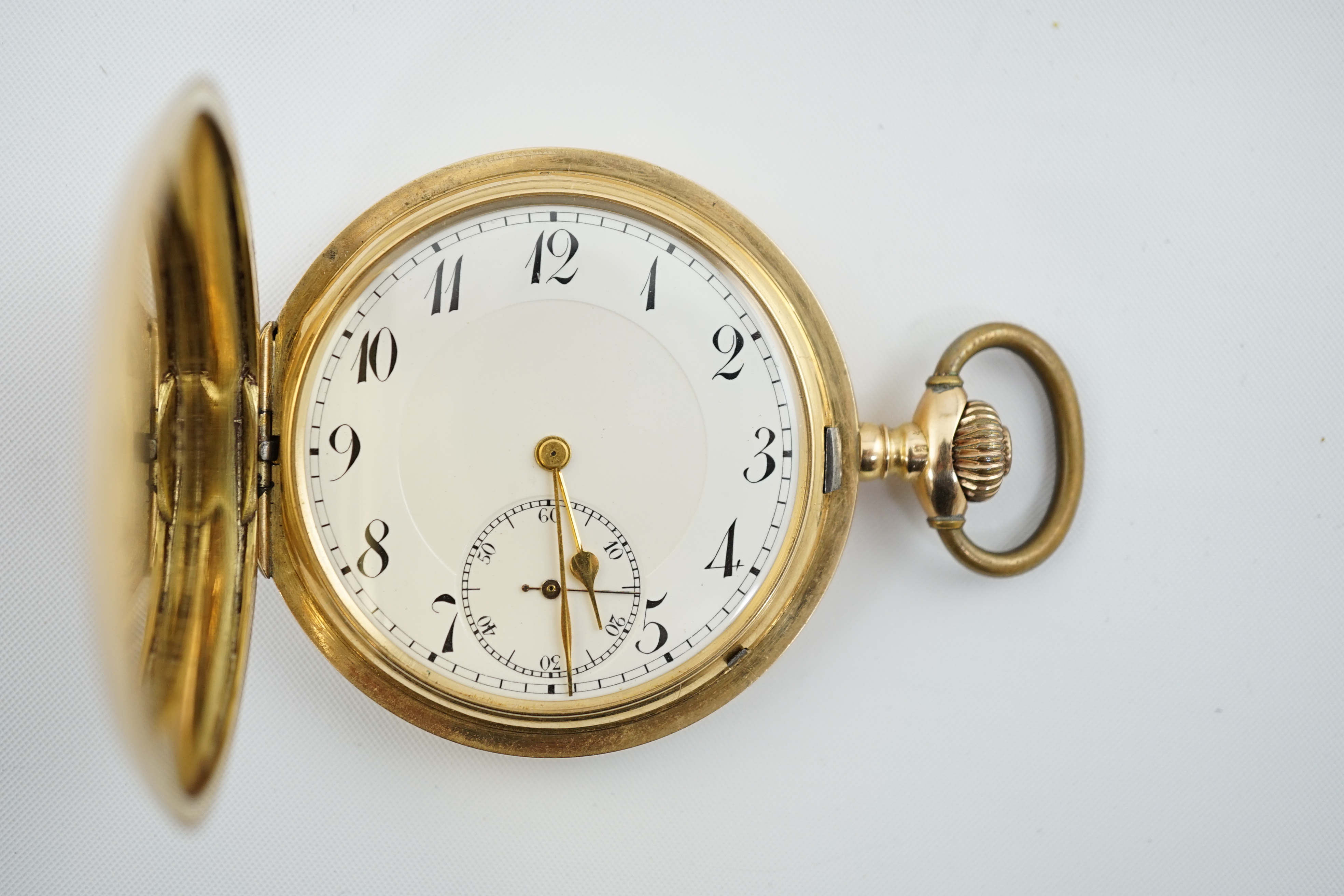 An early to mid 20th century Swiss engine turned 14k gold keyless lever hunter pocket watch